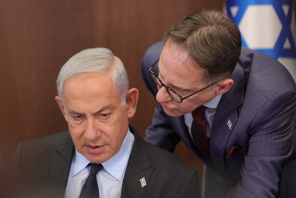 Prime Minister Benjamin Netanyahu speaks with Cabinet Secretary Tzachi Braverman (R) during a weekly cabinet meeting in the Prime Minister’s Office in Jerusalem on April 30, 2023. (ABIR SULTAN / POOL / AFP)